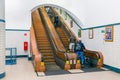 Pedestrians at wooden escalator in hiking tunnel river Schelde, Antwerp