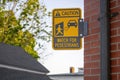 Caution watch for pedestrians yellow black street sign with figure and car graphics and star where injury may occur