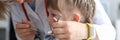 Pediatric dentist examines teeth little girl