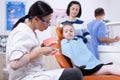 Pediatric dentist holding jaw model Royalty Free Stock Photo