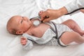 Pediatric doctor examines newborn baby girl with stethoscope