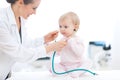 Pediatric doctor wearing baby stethoscope