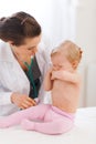 Pediatrician doctor calming crying baby