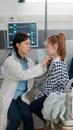 Pediatrician doctor consulting lungs listening heartbeat using medical stethoscope Royalty Free Stock Photo