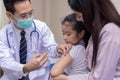 Pediatrician doctor doing vaccination of a little girl in hospital Royalty Free Stock Photo