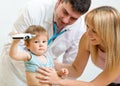 Pediatrician doctor examining child. Mother Royalty Free Stock Photo