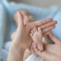 Pediatrician doctor examining cute baby girl and testing her reflex Royalty Free Stock Photo