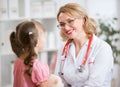 Pediatrician doctor examining kid Royalty Free Stock Photo