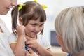 Pediatrician doctor examining kid patient with stethoscope Royalty Free Stock Photo