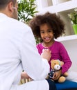 Pediatrician doctor examining kid Royalty Free Stock Photo