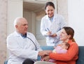 Pediatrician doctor examining three months baby Royalty Free Stock Photo