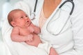 Pediatrician doctor is holding newborn baby in arms Royalty Free Stock Photo