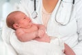 Pediatrician doctor is holding newborn baby in arms Royalty Free Stock Photo