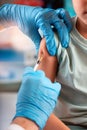 Pediatrician doctor with an injection in the hand for the vaccination of a child Royalty Free Stock Photo