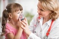 Pediatrician doctor making inhalation to kid Royalty Free Stock Photo