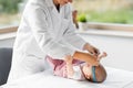 Pediatrician doctor measuring bab`s head at clinic