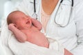 Pediatrician doctor is holding newborn baby in arms Royalty Free Stock Photo