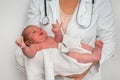 Pediatrician doctor is holding newborn baby in arms Royalty Free Stock Photo