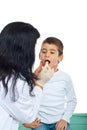 Pediatrician examine throat kid