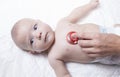 Pediatrician examines newborn baby boy with stethoscope Royalty Free Stock Photo