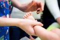 Pediatrician examining little baby in clinic. Closeup of a child& x27;s leg in doctor& x27;s hands. Royalty Free Stock Photo