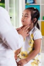 Pediatrician examining lymph nodes