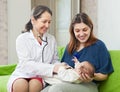 Pediatrician examining newborn baby Royalty Free Stock Photo
