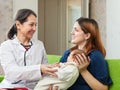 Pediatrician examining newborn Royalty Free Stock Photo