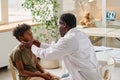 Pediatrician examining sore throat of little patient Royalty Free Stock Photo