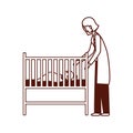 Pediatrician female doctor with baby in cradle