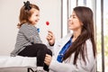 Pediatrician giving a lollipop Royalty Free Stock Photo