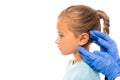 Pediatrician in gloves touching ear of