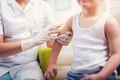 Pediatrician makes vaccination to boy