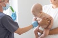 Pediatrician makes vaccination to small boy Royalty Free Stock Photo