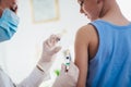 Pediatrician makes vaccination to small boy. Royalty Free Stock Photo