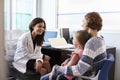 Pediatrician Meeting With Mother And Child In Hospital