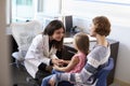 Pediatrician Meeting With Mother And Child In Hospital