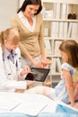 Pediatrician point at x-ray girl broken leg Royalty Free Stock Photo