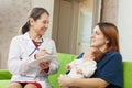 Pediatrician of prescribes to newborn baby the medication Royalty Free Stock Photo