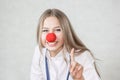 A pediatrician with a red nose. doctor