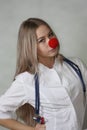A pediatrician with a red nose. doctor