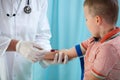 Pediatrician taking blood sample