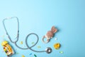 Pediatrics concept. Stethoscope and toy on a light background Royalty Free Stock Photo