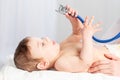 Pediatrics, a doctor examines a baby boy and uses a stethoscope to listen to the child`s breathing, the concept of medicine and