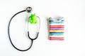 Pediatrics equipment with toys, stethoscope white background top view space for text