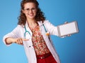 Pediatrist doctor pointing at tablet PC blank screen Royalty Free Stock Photo