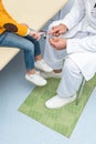 pediatrist showing reflex hammer to girl