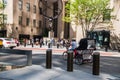 A pedicab is seen riding along an avenue in Manhattan in front of the Atlas statue at Rockefeller Plaza