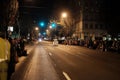 Pedicab zooms down empty downtown street, crowds lining both sid