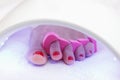 Pedicure foot and nails treatment with  UV lamp Royalty Free Stock Photo